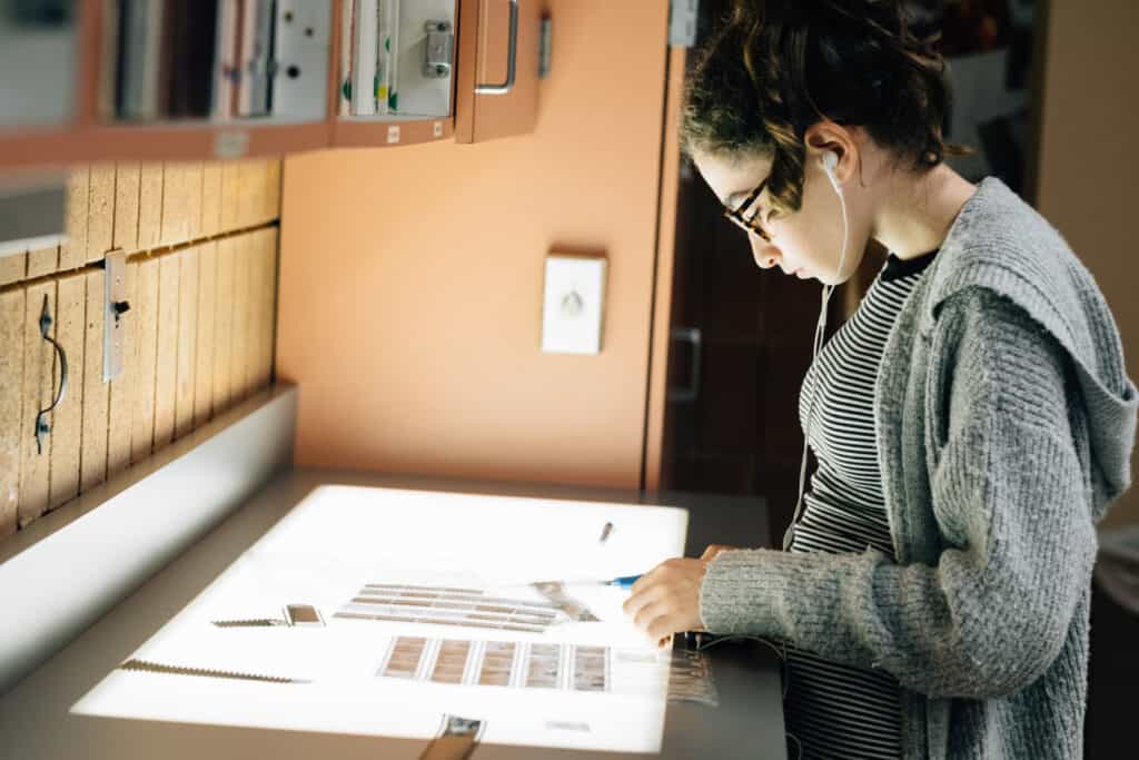 woman looking at negatives