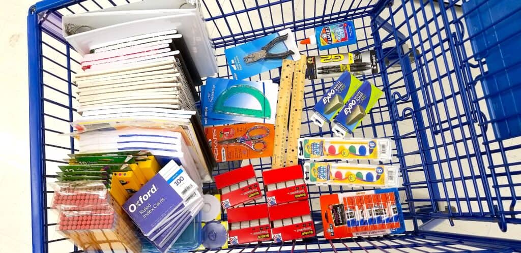 school supplies in blue shopping cart