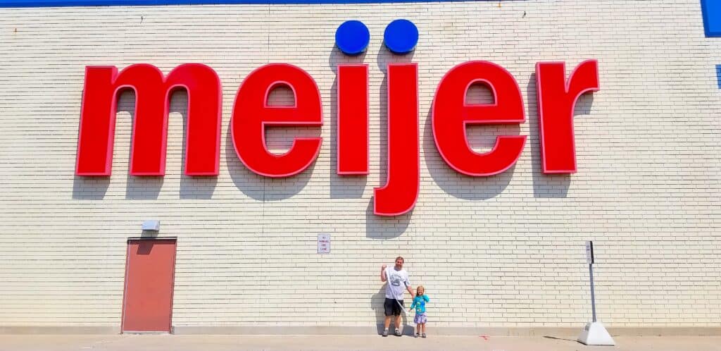 father daughter in front of meijer store