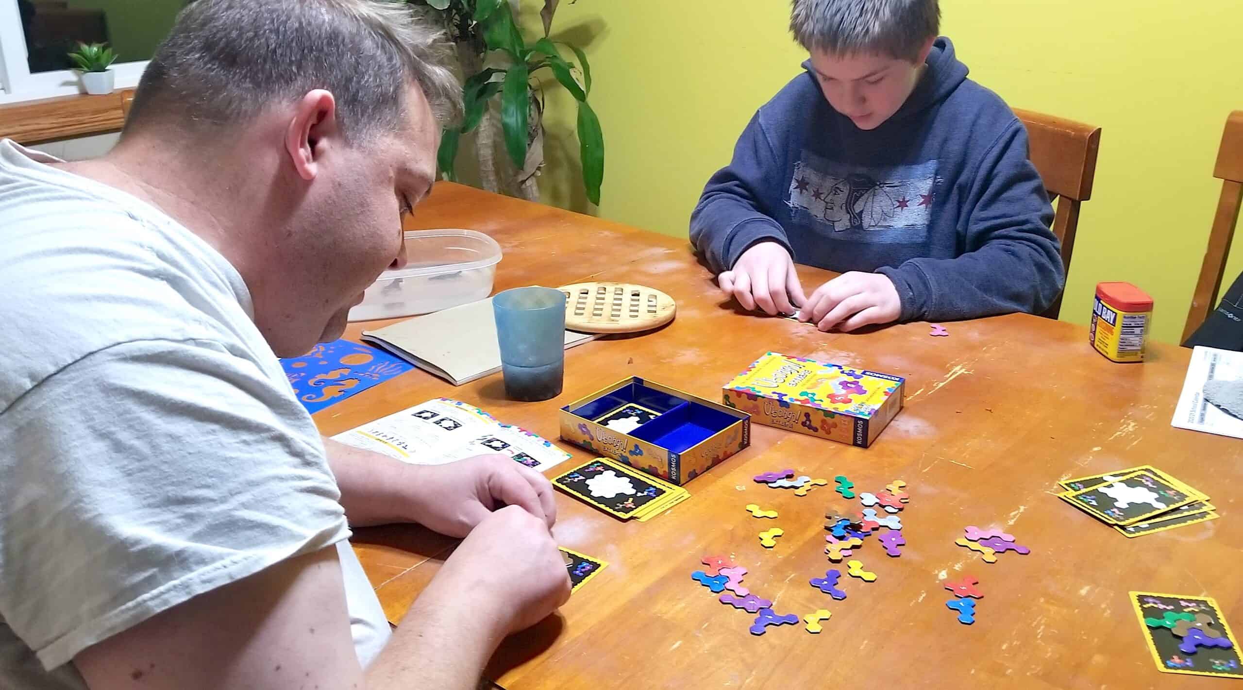 dad and teen playing math game Ubongo Extreme