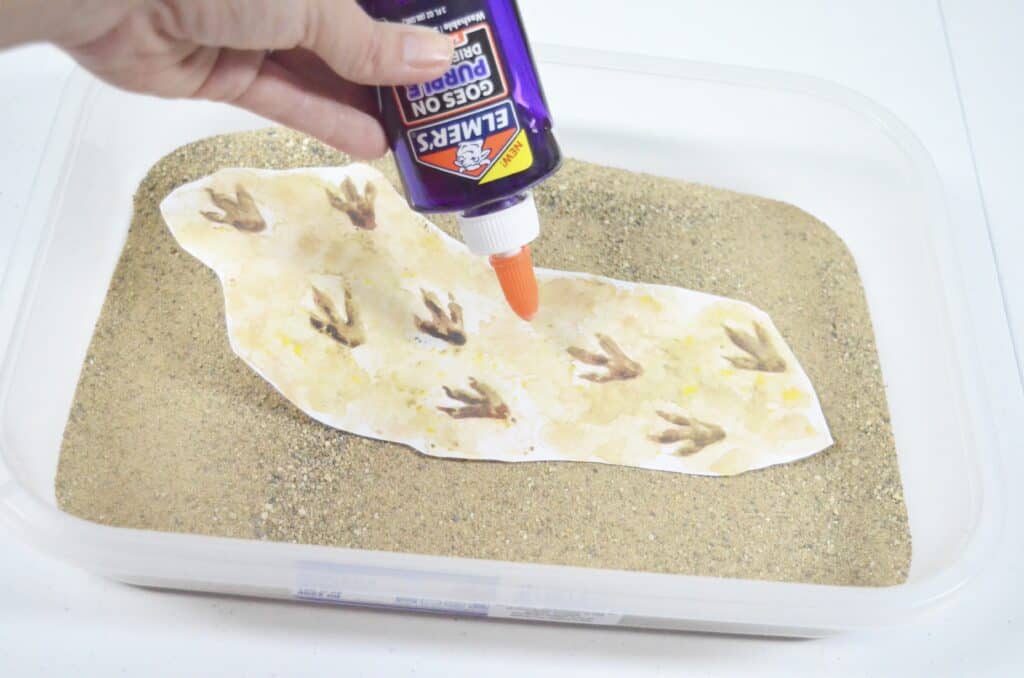 Dinosaur Sensory Bin Textured Dig This! Activity with Printables