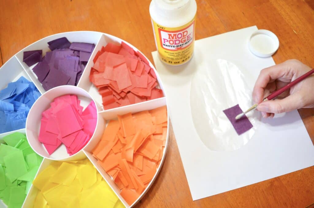 adding glue to tissue paper mod podge craft