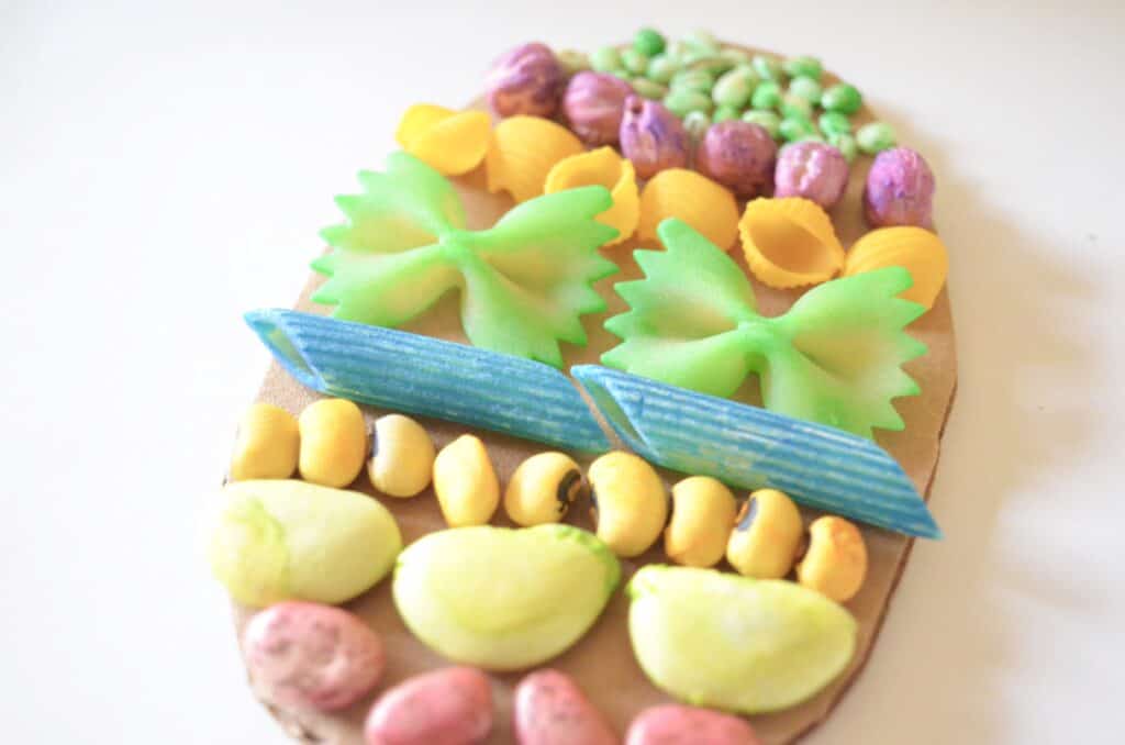 pasta noodles and beans on easter egg craft