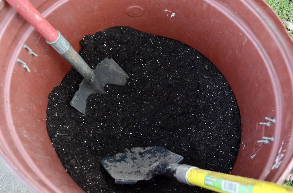 large pot of dirt and potting soil