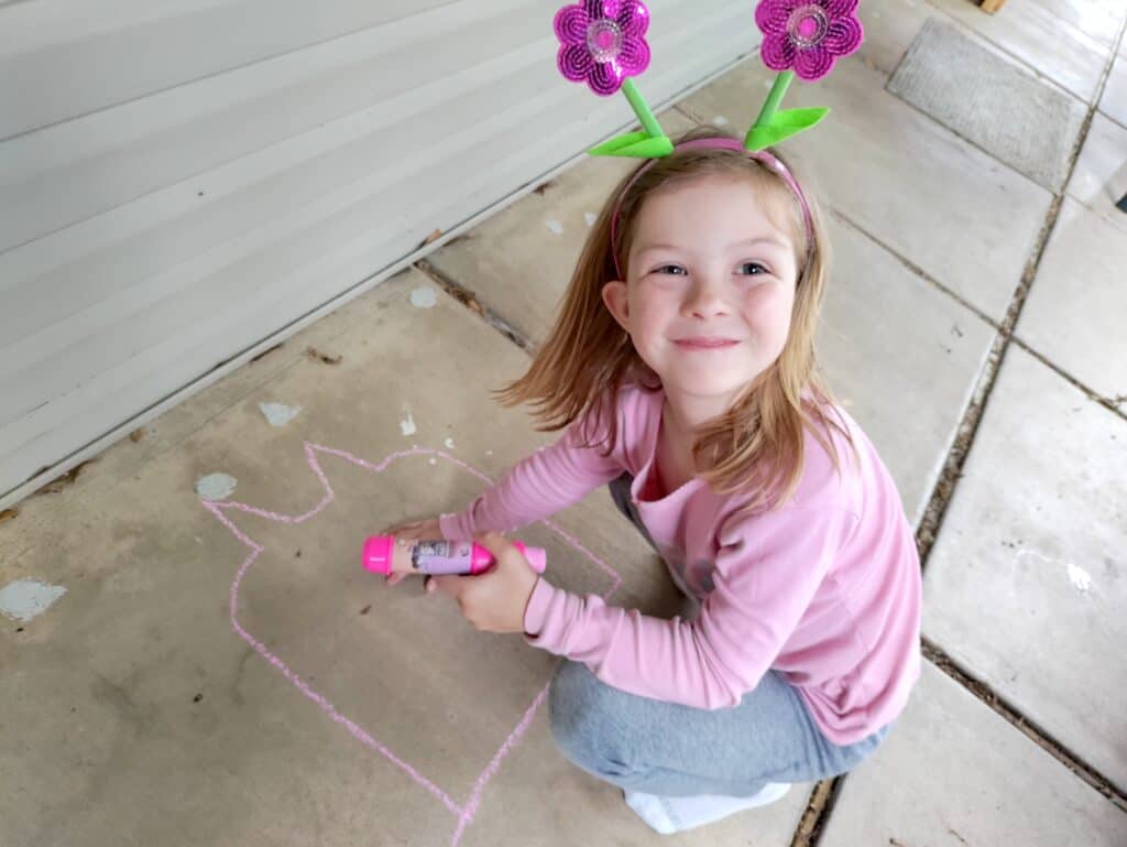 chalk art with young girl smiling