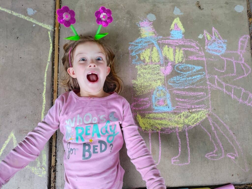 happy girl with her chalk art