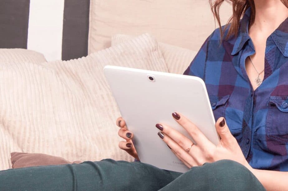 woman holding tablet stock