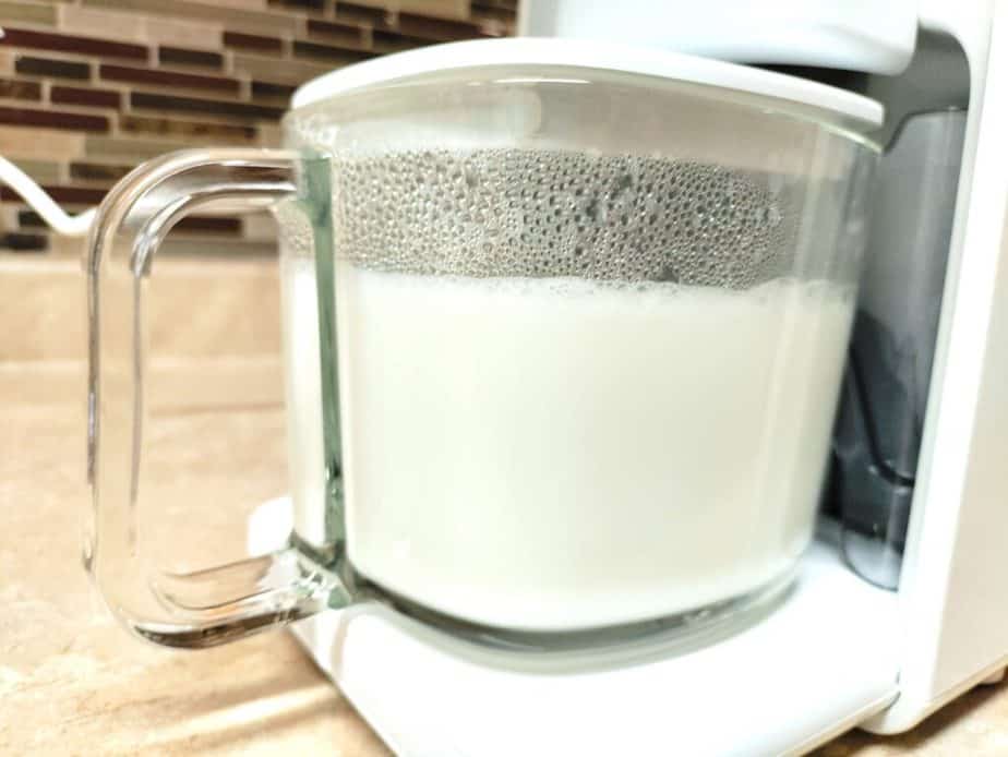 glass pitcher of fresh homemade milk
