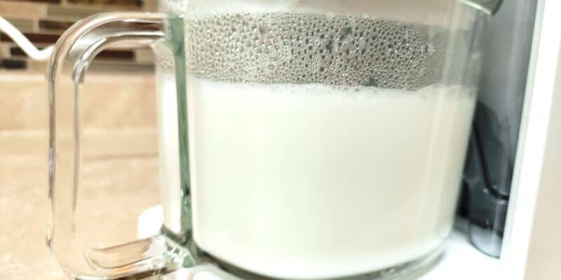 glass pitcher of fresh homemade milk